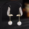 TheVineGirl  Korean Studded Wing Pearl Tassel Drop Earrings For Women And Girls Metal Drops & Danglers